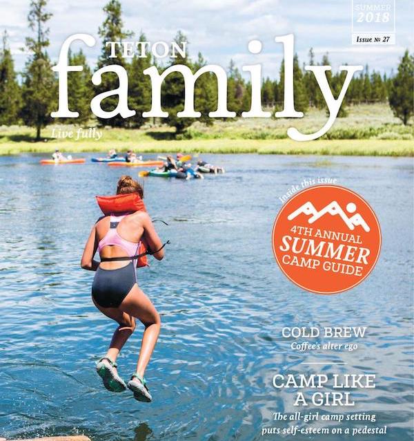 front cover of Summer 2018 Teton Family with girl wearing PFD jumping into a lake with kayakers in background