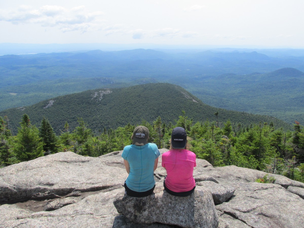 Two students take a break while backpacking in the Adirondacks Two students take a break while backpacking in the Adirondacks