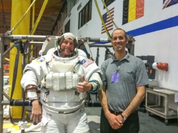 An astronaut, Reid Wiseman, and Urmston, who dreams of becoming one, in NASA's Neutral Buoyancy Lab. Photo from Popular Mechanics An astronaut, Reid Wiseman, and Urmston, who dreams of becoming one, in NASA's Neutral Buoyancy Lab. Photo from Popular Mechanics