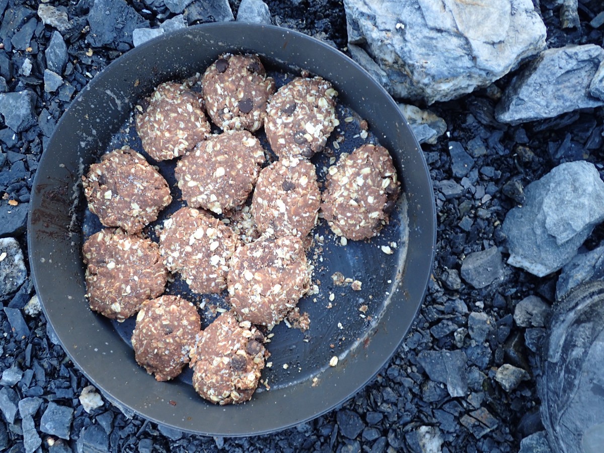 peanut butter and oatmeal no-bake cookies in a fry bake sitting on pebbly ground