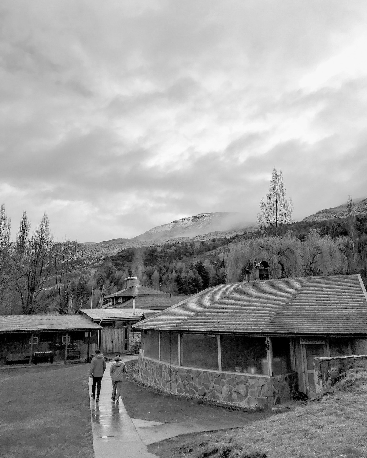 Two people walking at the NOLS campo in Chile