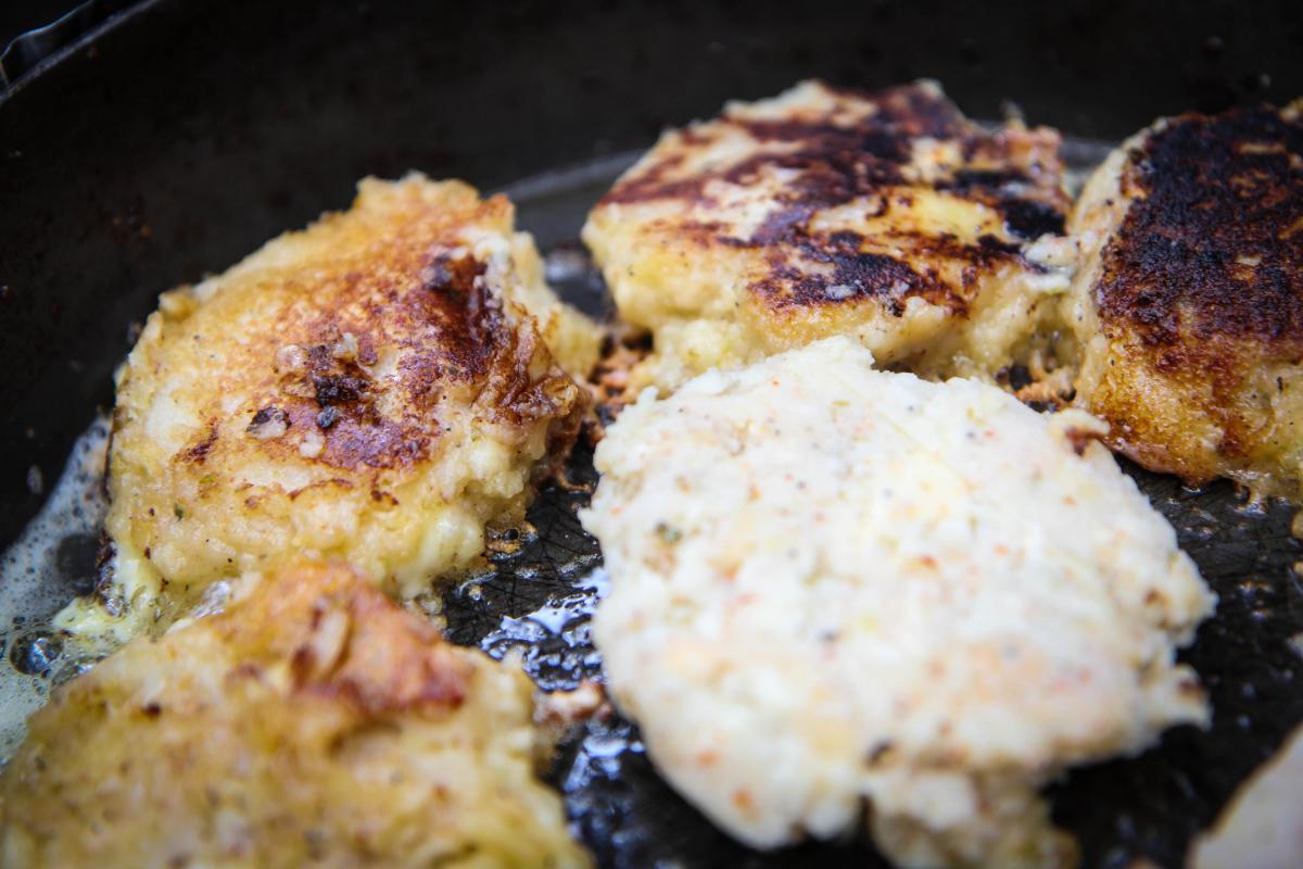 Close up of cakes frying in a pan