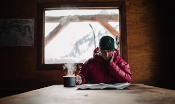 Bridget Grove studies up in Keith’s Hut near Pemberton, B.C. [Photo] Garrett Grove