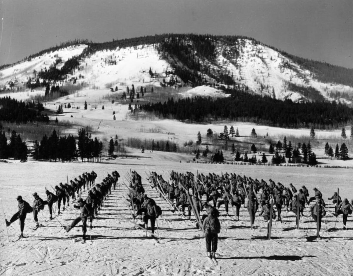 10th Mountain Division troops in alignment on skis.